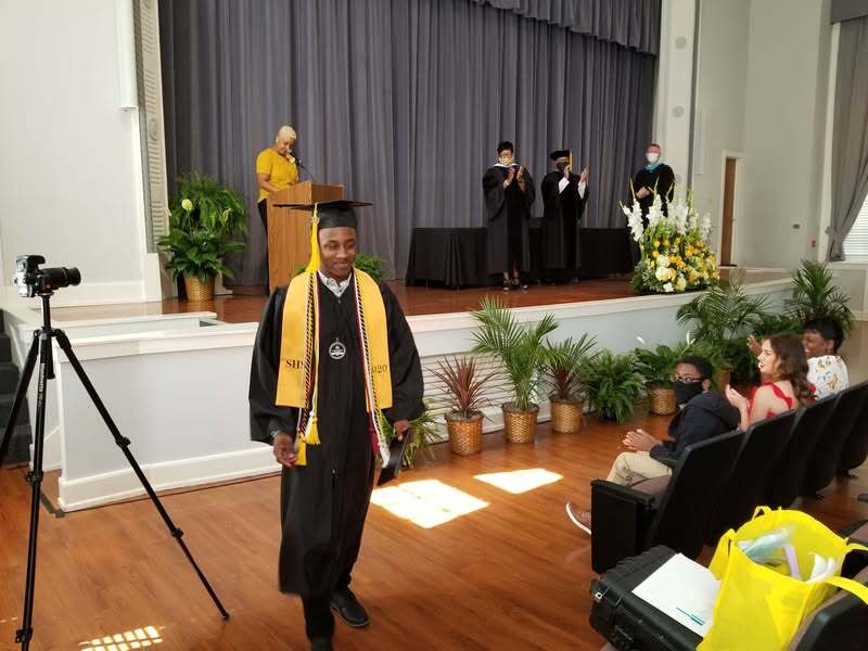 Chris Luckett graduating with high honors in 2020.