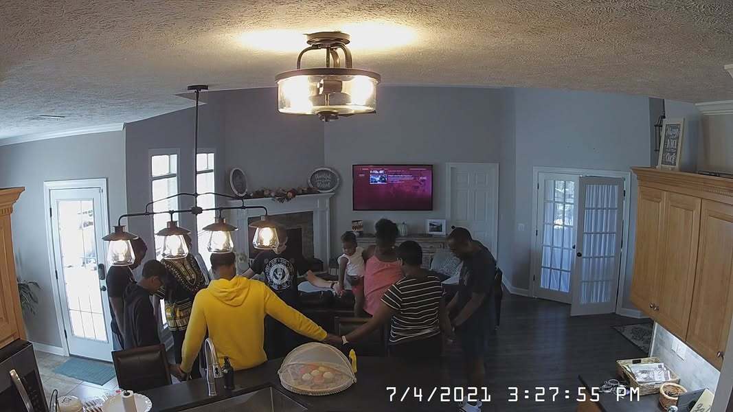 Family praying for America on the 4th of July.